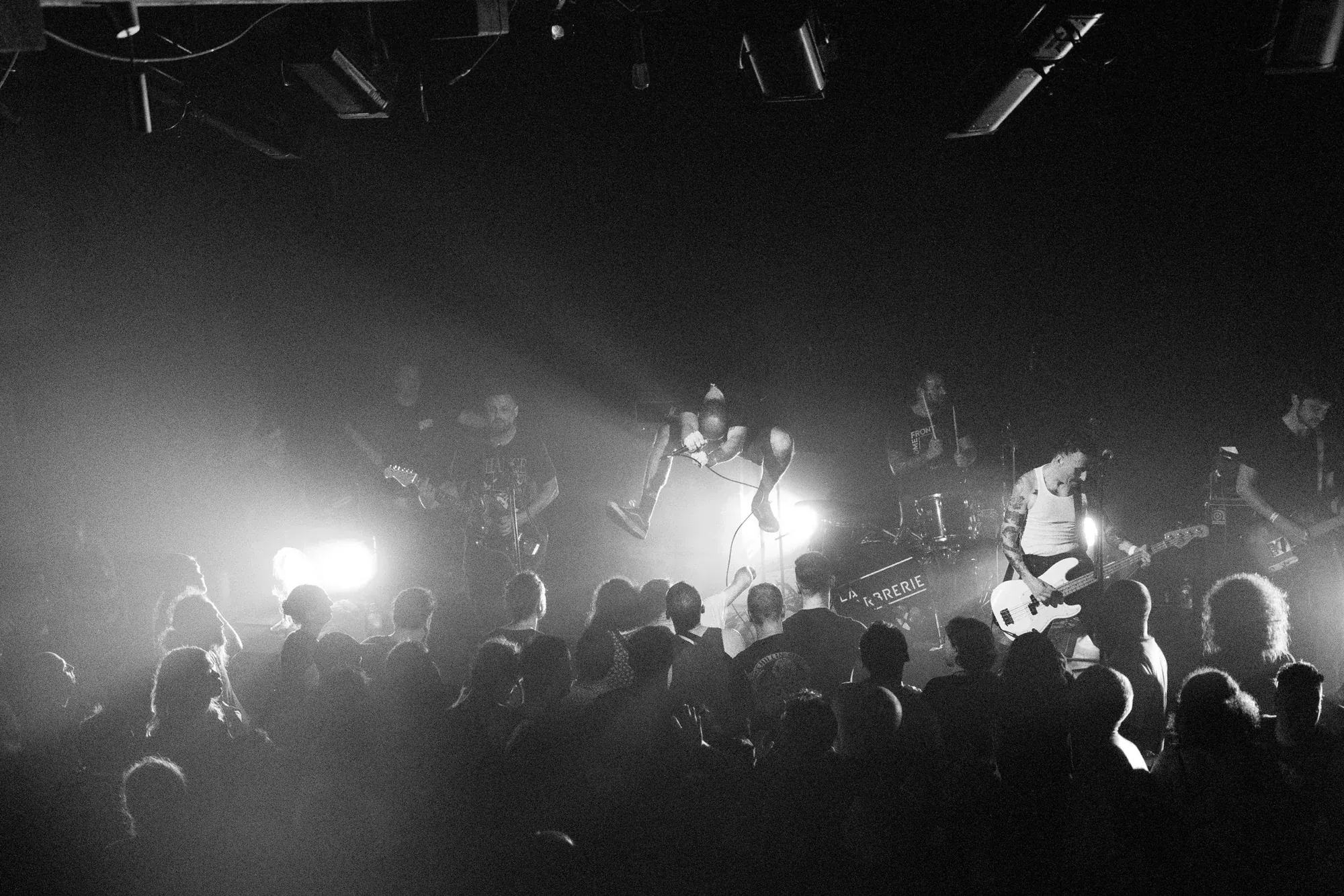 Wide view of a live stage and crowd, photographed by Helen Milova
